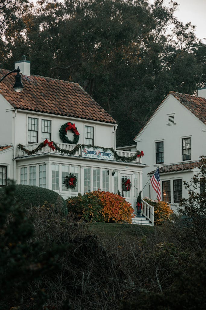 Quaint San Francisco house adorned with Christmas wreaths and American flag.